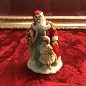Beautiful hand painted porcelain Santa and child from Avon Collectables